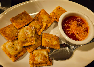 Zia's signature dishes Chicken Parm Sandwich
House Salad
Toasted Ravioli